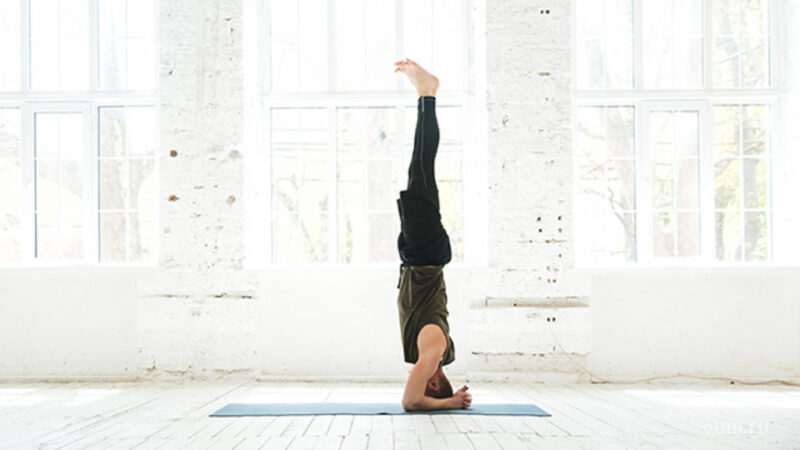 man-practicing-advanced-yoga