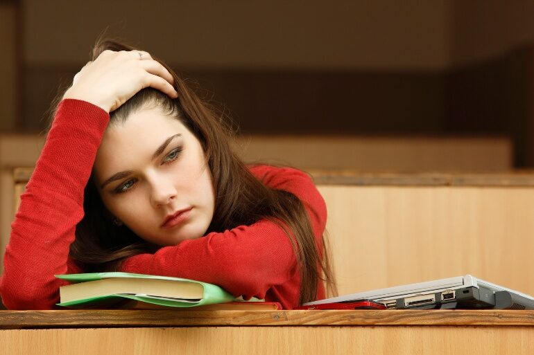 student-teen-girl-beautifyl-tired-in-empty-classroom-university